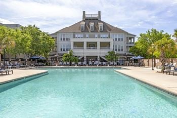 Resort-inspired swimming pool with sundeck